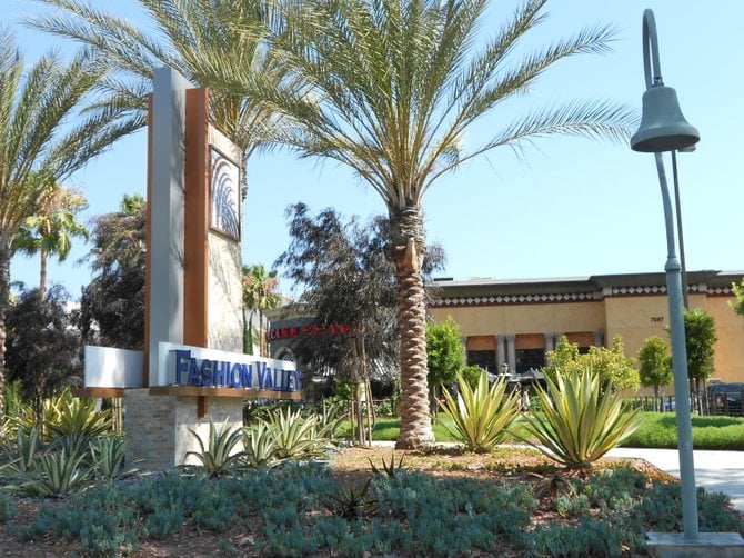 Entrance to Fashion Valley Mall with Mission Bell in foreground.