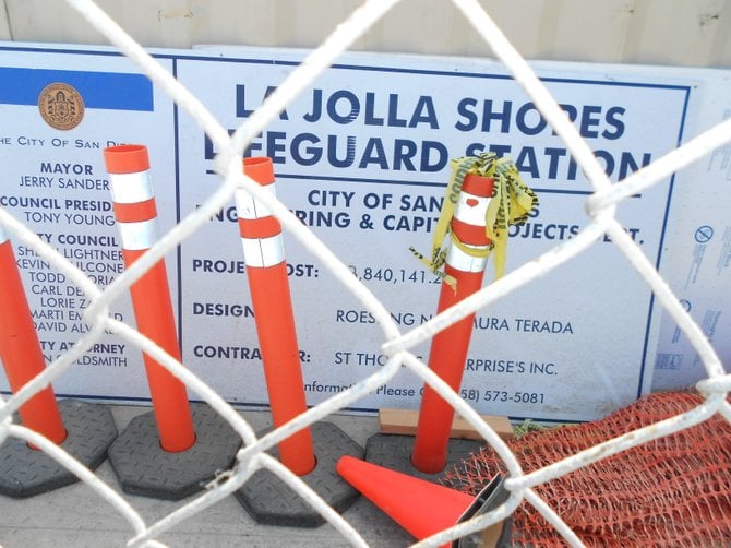 City signage trapped behind wire fences at La Jolla Shores.