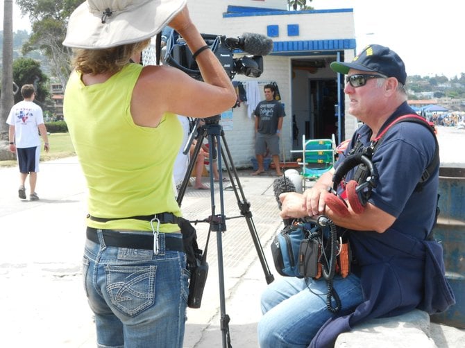 Film crew from the Weather Channel's cable show "Lifeguards" filming at La Jolla Shores.