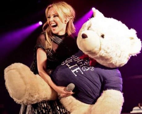 Taylor Swift loves her teddy bear almost as much as she loves her signature guitar...and it looks like teddy loves her too!