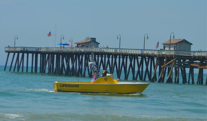 San Clemente Pier, with Lifeguard Rescue boat patrolling the shore