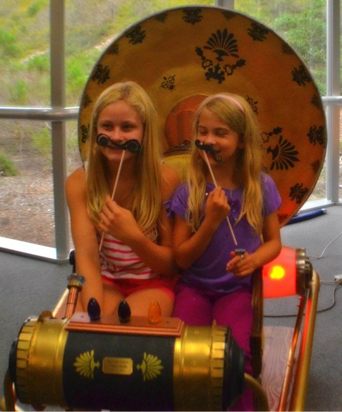 Aidan Hart and Claire Hooper testing out the Time Machine at the Steampunk Tea, UCSD