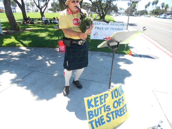 Playing the bagpipe at Mission Beach Surfrider demonstration.