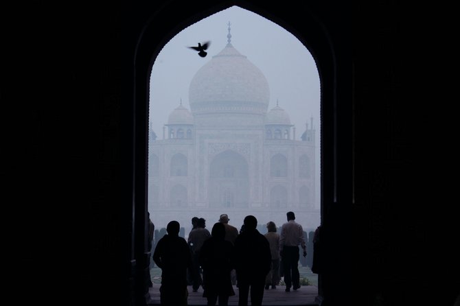 Taj Mahal in Agra: a gloomy, mystical stroll through the wondrous gardens of the eighth wonder of the world.