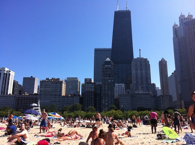 Summer in the city: Chicago's downtown skyline rises up imposingly behind Oak Street beach. 