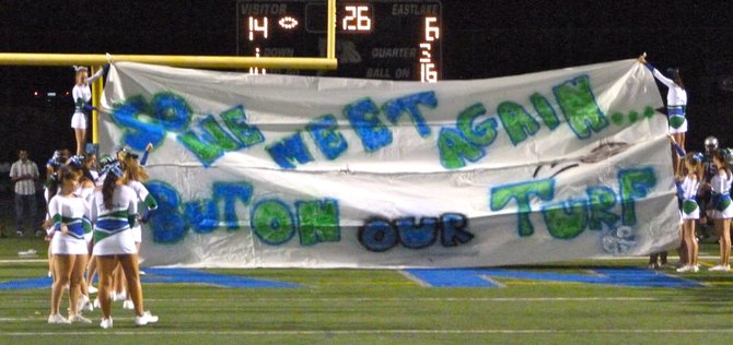 Eastlake's cheerleaders fire a barb at Helix with their halftime banner