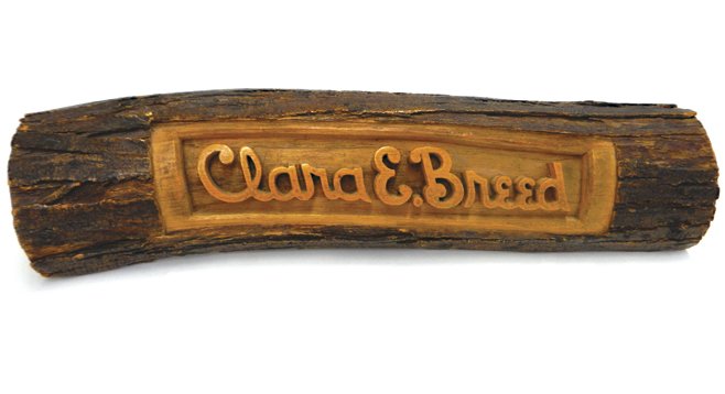 Tets carved this wooden nameplate for Clara with a bedspring.