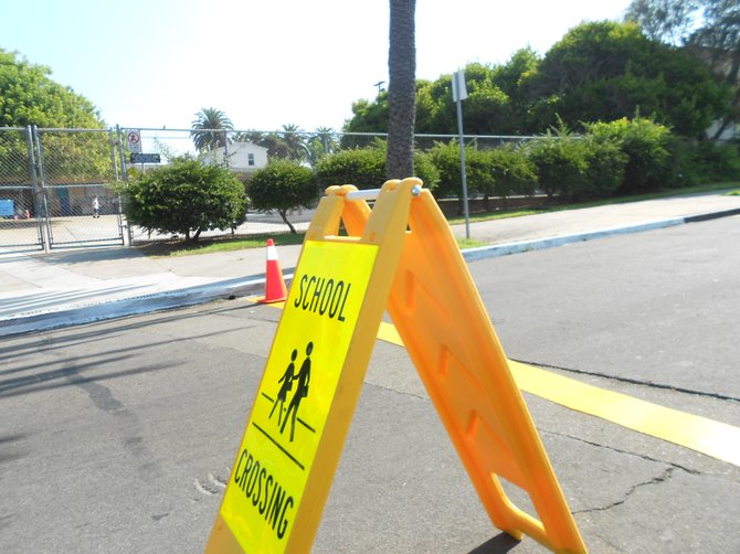 School crossing sign along Santa Monica Ave. in Ocean Beach.