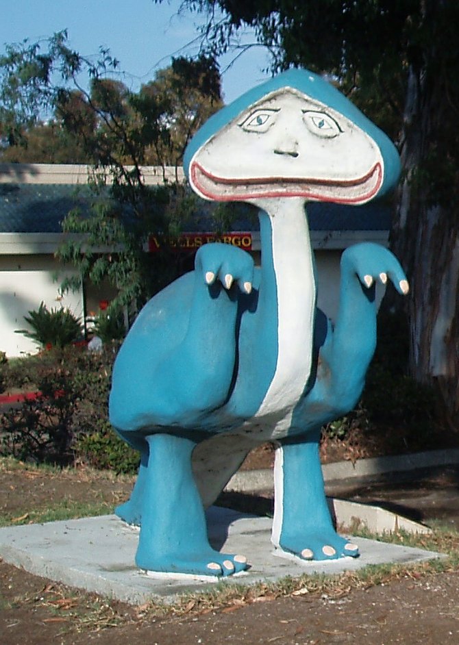 This is Rangui the blue Glarf. A Glarf is a cross between a dwarf and a dinosaur. The Glarfs were named and created by a 15 year old boy named Jerry Lee Gauss some time in the 1960's. Jerry died in a traffic accident at age 19. This Glarf, along with it's companion, Rumbi, the yellow Glarf, used to reside in the front yard of the Gauss family's home home on Valley Road in Bonita until they disappeared in 1970. They were found found again in 1993 and relocated to their current spot in front of the Bonita Village Shopping Center on Bonita Road in 1999.   