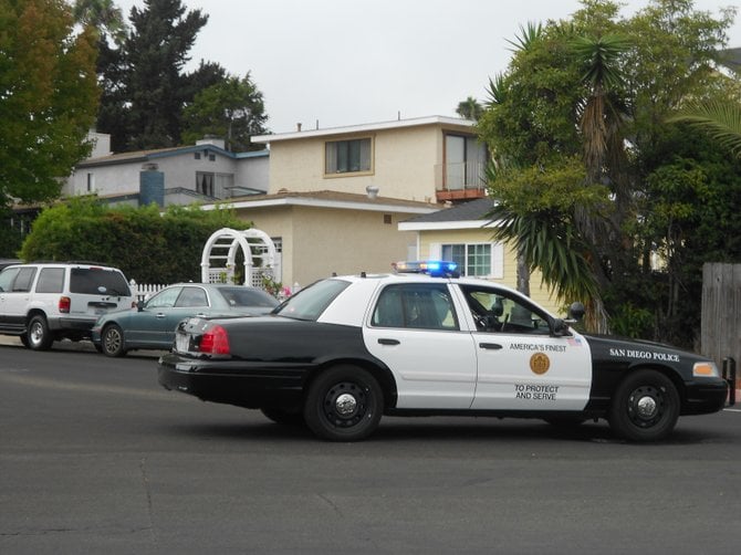 SDPD blocking a street near accident in Pt. Loma.