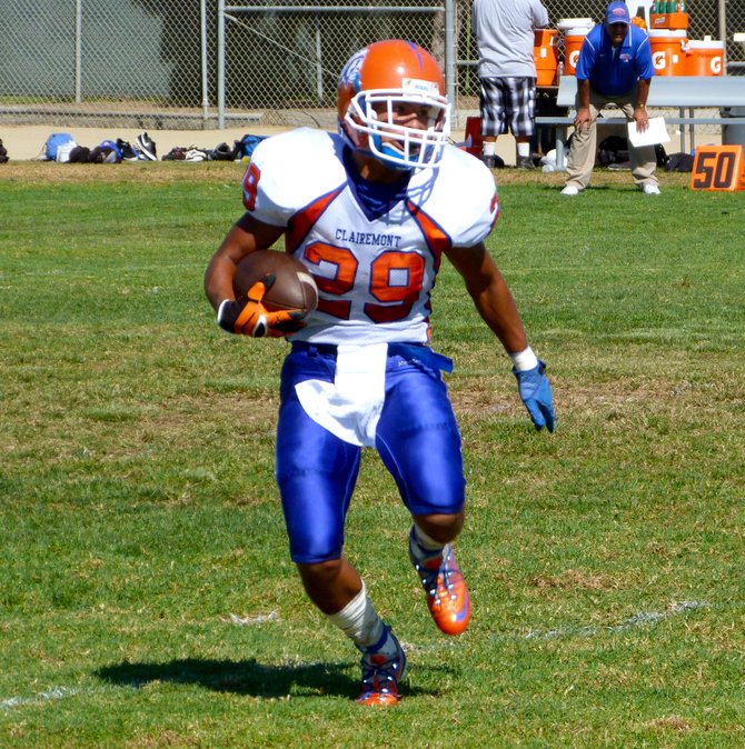 Clairemont senior running back Nick Espinoza carries the ball in space