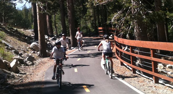 Bikers on the five-mile Lake Mary Road Bike Path in Mammoth Lakes, California, can go the easy way (down)... or the hard way (up). 