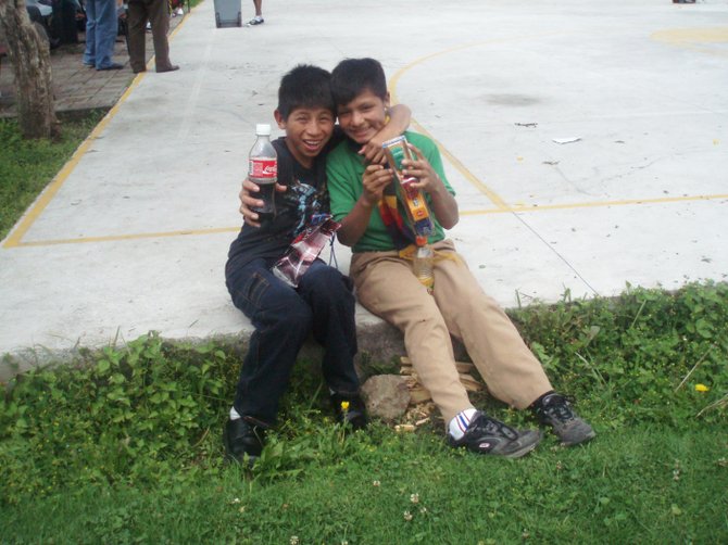 Two happy kids at the Christmas celebration at Casa de la Ninez orphanage, Quito, Ecuador (no product placement intended)