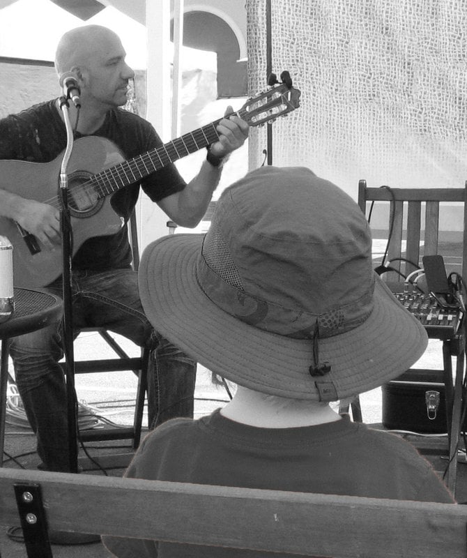 A young boy listens to music at the Farmer's Market in Rancho Santa Fe.