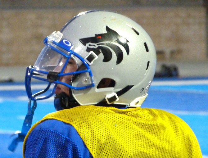 A West Hills player watches practice from the sidelines