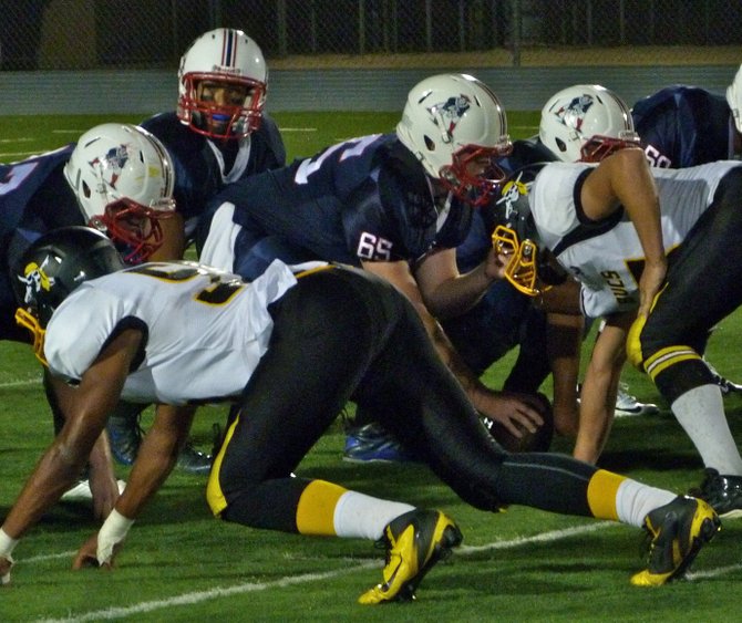 Christian junior quarterback Michael Carrillo surveys the Mission Hills defense while under center