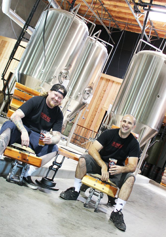 Greggory Webb (left) and John Maino share a laugh and a few cold ones in their new Temecula brewhouse.