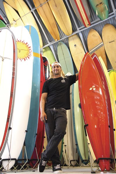 Pro surfer Isaac Wood at Bird’s Surf Shed. "I had bosses that all surfed, and they would come back and be, like, ‘Oh, you missed it. It was so good!’”