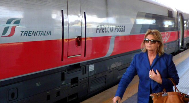 Speed meets style: the luxurious high-speed Frecciarossa connects Milan and Rome in under three hours. 