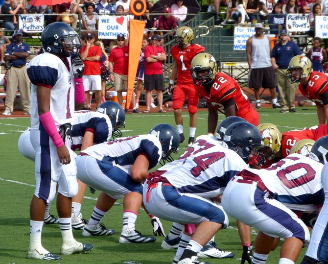 Horizon senior quarterback Markel Byrd surveys the Santa Fe Christian defense before getting under center