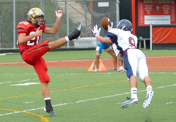 Horizon sophomore defensive back Anthony Oseguera lays out to block a punt by Santa Fe Christian junior Drew Shields