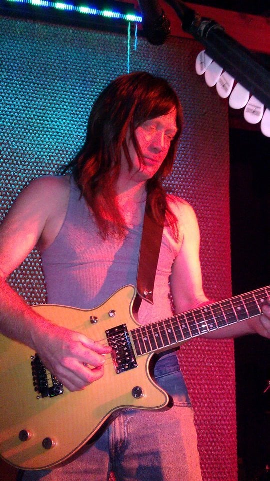 Cap Lillard as Malcolm Young