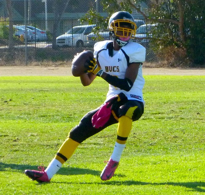 Mission Bay sophomore quarterback Devon Johnson looks for receivers downfield