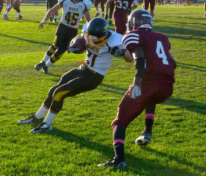 Mission Bay senior receiver Kyle Plum shakes Kearny senior defensive back Will Pierre with a spin move