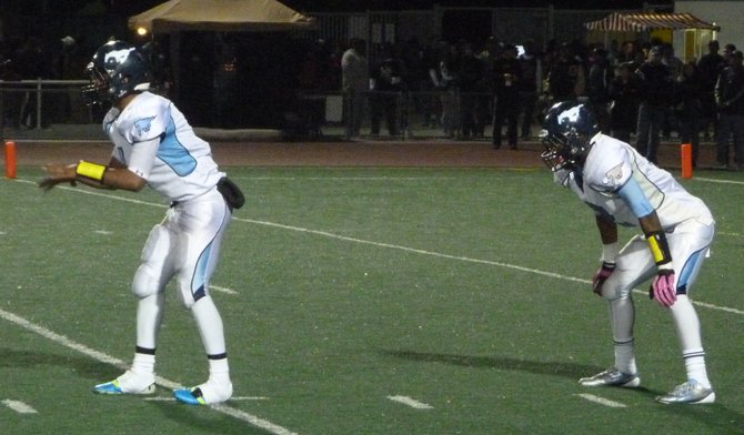 Otay Ranch junior quarterback Kyle Hawkins (left) and junior running back Anthony Williams in the backfield before the snap