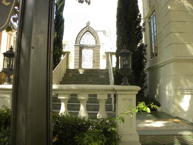 The fairy tale gate leading to the apartments at The Chateau Rossmore.