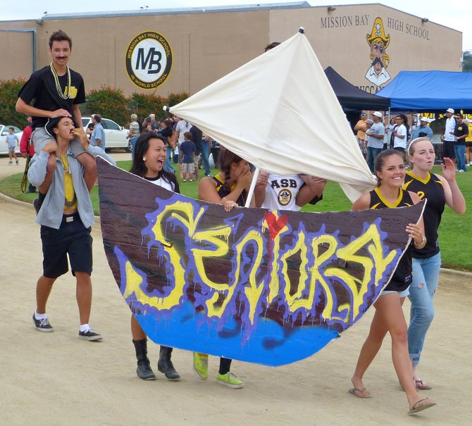 Members of Mission Bay's senior class have a blast while parading during Homecoming
