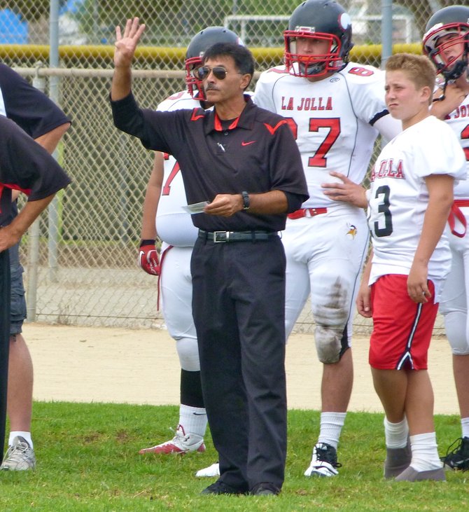 La Jolla head coach Rey Hernandez calls out a play from the sideline