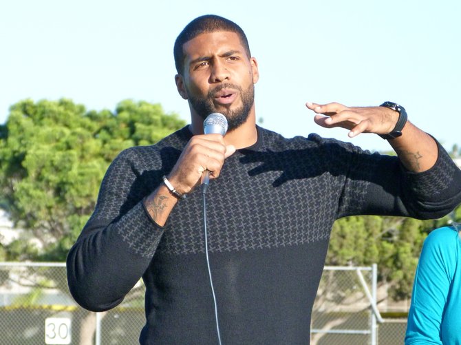 Houston Texans running back Arian Foster speaks to the crowd during his jersey retirement ceremony at Mission Bay high