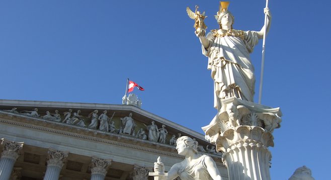 Athena keeps watch outside the city's majestic Austrian Parliament Building. 