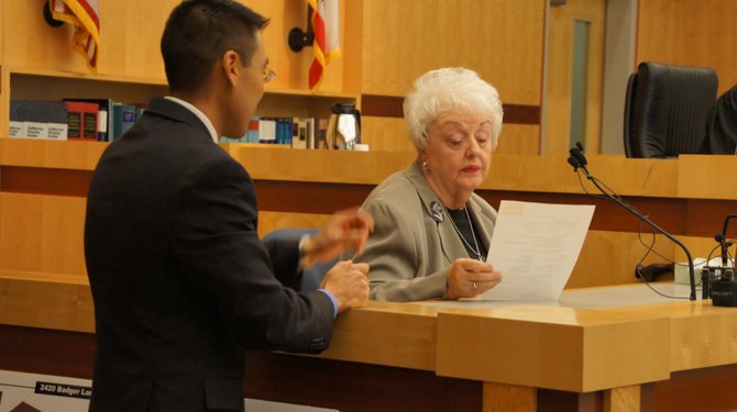 Prosecutor Keith Watanabe with Mrs. Lina Harper.  Photo Weatherston.