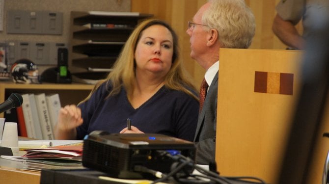 Julie Harper and defense attorney Paul Pfingst.  Photo Weatherston.