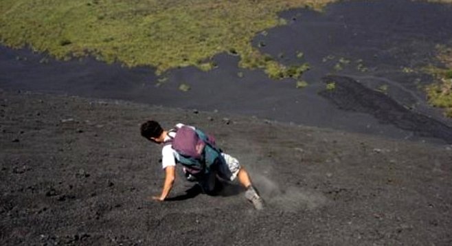 Volcano boarding is a sport all its own –and the board's optional, as this foot-slider on Cerro Negro demonstrates. 