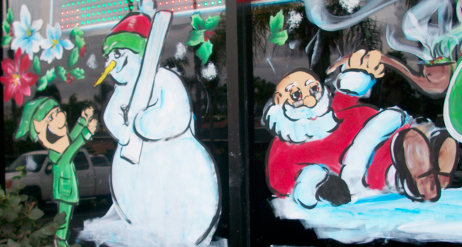 Santa and Frosty on Outer Limits Smoke Shop's window