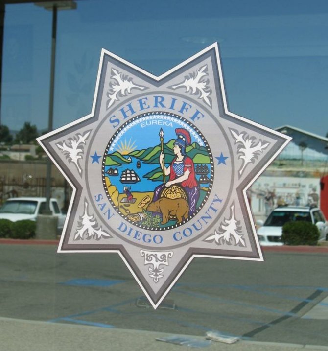 San Diego County Sheriff emblem.