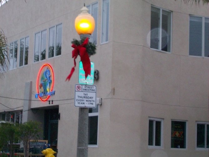 Festive Christmas touches on lamps in Ocean Beach.