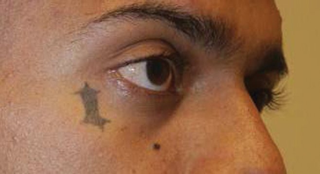 Oceanside gang member Luciano Velasquez’s tattoos were used to identify him as the shooter in an attempted triple homicide in Carlsbad.