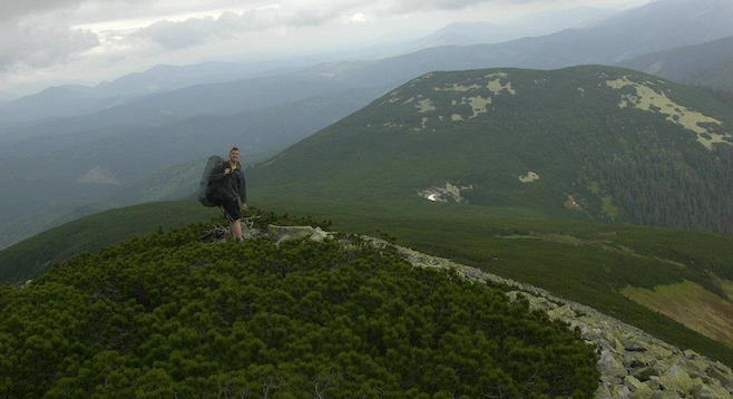 At the summit: a view of Eastern Europe's Carpathian Range stretching toward the horizon.