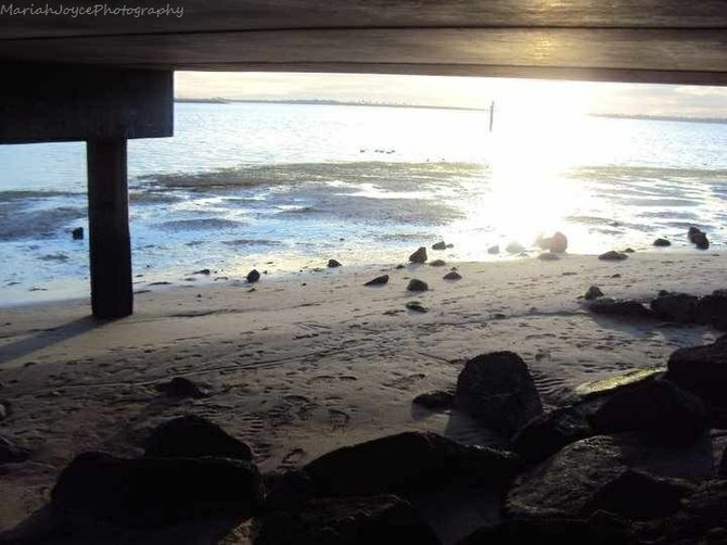 This photo is taken at J street marina in Chula Vista, San Diego. It is located under the fishing pier during sunset. 