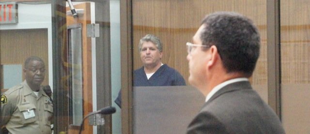 Michael T. Pines and prosecutor Romo in court.  Photo Weatherston.