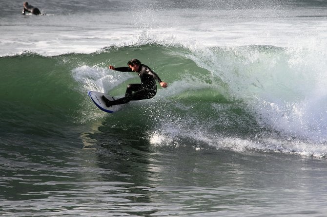 Smooth glassy afternoons and perfect northerly swells make winter surfing at Sunset Cliffs natural Park, Ocean Beach the best in San Diego.