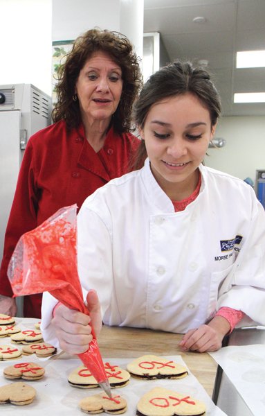 Instructor Sara Smith-Piatti with her student at Morse High School’s 
state-of-the-art culinary kitchen.