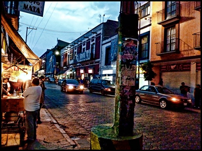 Street at dusk in the city of Puebla, east of Mexico City. 