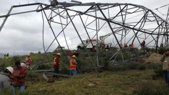 Downed transmission tower though to e the work of a thief (photo from El Mexicano)
