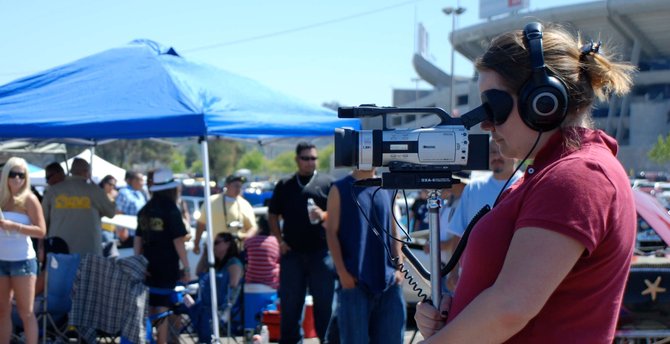 Director Gloria Moran and her handy Canon 3CCD at Qualcomm Stadium capturing the action of Lowriderfest, 2011.