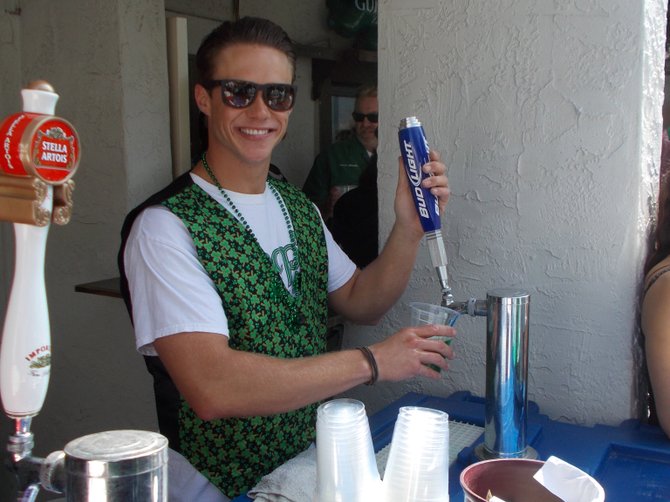 Greg McPartlin is the guy serving the green beer (Bud Light, $4)